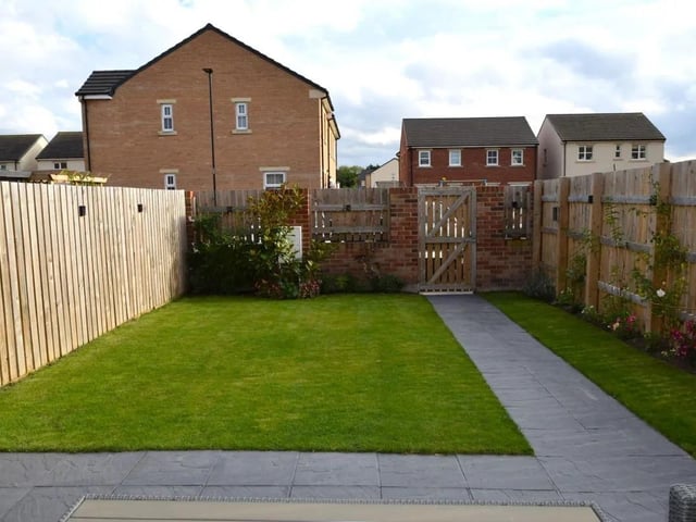 A lawned garden with planted borders.