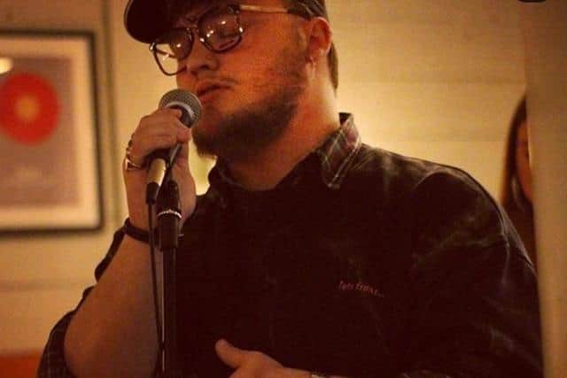 James singing at an event before Covid-19.
