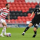 Lee Tomlin missed Doncaster's match against Rochdale through injury.