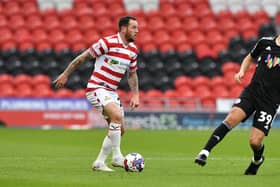 Lee Tomlin missed Doncaster's match against Rochdale through injury.