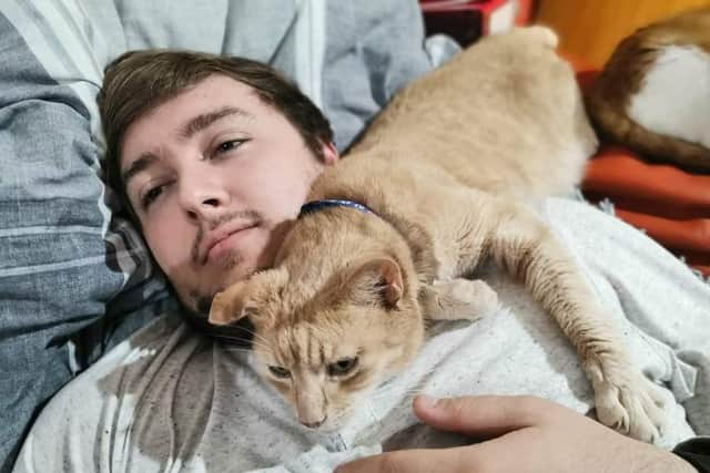 Animal lover Steven, pictured with his rescue cat Gizmo.