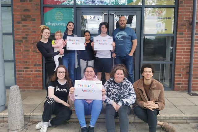 Doncaster Housing for Young People representatives with the £1,000 cheque
