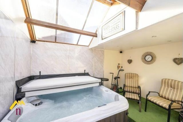 This exceptional home has a bar and hot tub area with a sliding roof for stargazing.
