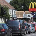 Cars queue at a Drive Thru McDonald's  (Photo by Andrew Redington/Getty Images)