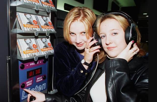 Jenny Newsham and Gemma Bush both aged 16. Listening to music in HMV.