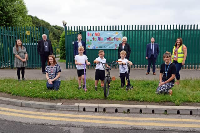 Back (from left) Councillor Gemma Cobby, Councillor Nidge Ball, Cabinet Member for Public Health, Leisure, Culture and Planning, Councillor Jake Kearsley, Ros Jones, Mayor of Doncaster, James Bullock, Lakeside Primary Academy Headteacher and Laura Ashton. Front l-r Sally Smith, SENCO, Maisy, Joe, Zachary and Roz Stringer, family support manager, pictured outside Lakeside Primary Academy. Picture: NDFP-13-07-21-AirPollutionEvent 1-NMSY