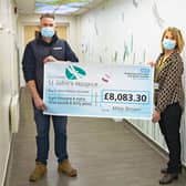 Mike presenting his cheque to Tracey Gaughan from St John’s