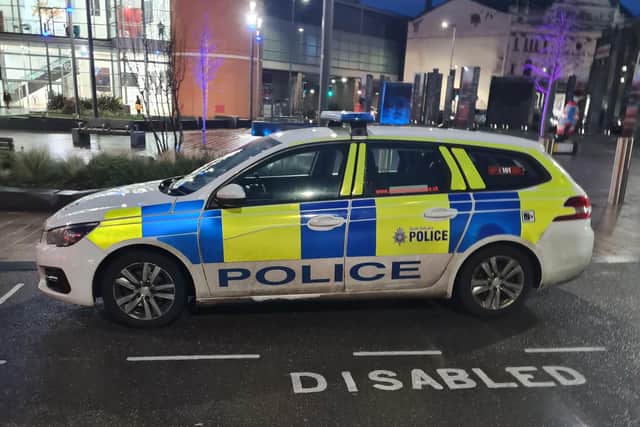 The police car in the disabled bay.