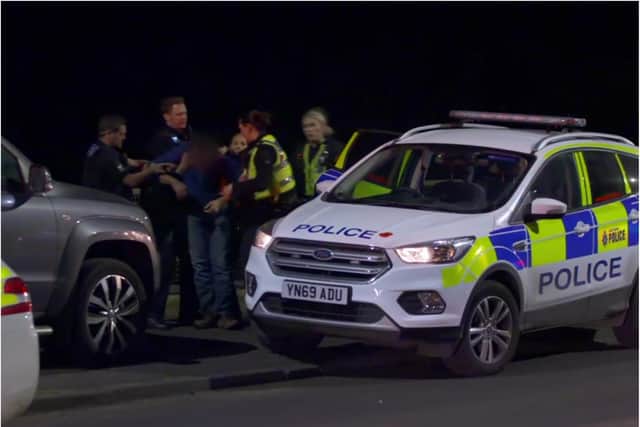 Police rescue the man from the bridge over the M18 in Doncaster.  (Photo: Channel 4).