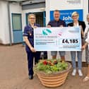 Kelly Claxton (second right) and Mark Claxton (second left) are pictured with Chloe Mawson (left) and Maureen Harwood (right) from St John’s Hospice.