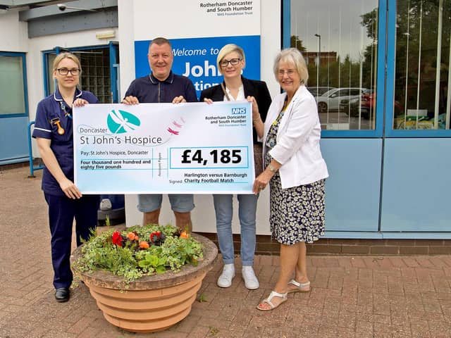 Kelly Claxton (second right) and Mark Claxton (second left) are pictured with Chloe Mawson (left) and Maureen Harwood (right) from St John’s Hospice.