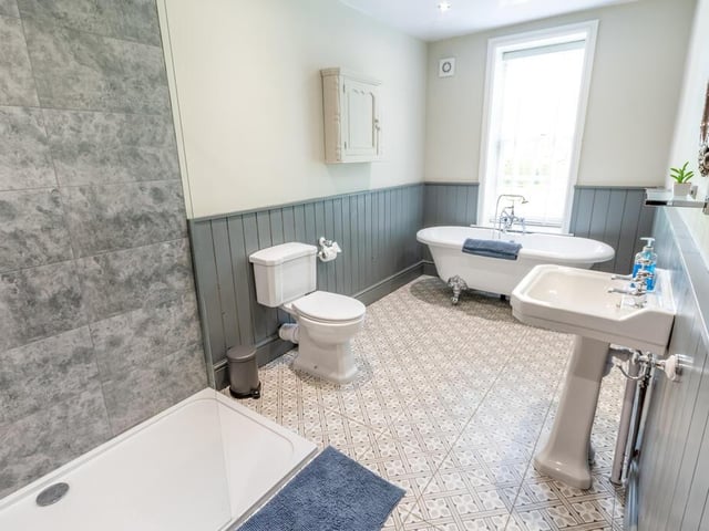 One of five stylish bathrooms.