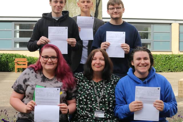Pupils picking up results at Trinity Academy.