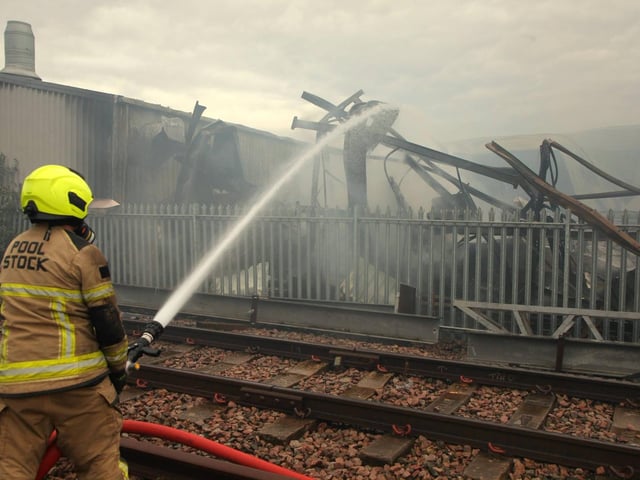 The fire destroyed vehicles, equipment, stock and tools.