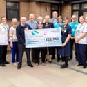 Service Manager Sam Edwards (fifth from right) is pictured with St John’s Hospice staff and representatives from the Lions groups involved with the fundraising.