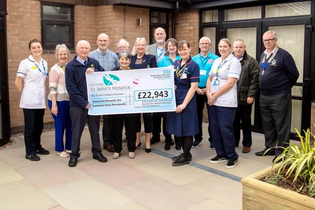 Service Manager Sam Edwards (fifth from right) is pictured with St John’s Hospice staff and representatives from the Lions groups involved with the fundraising.
