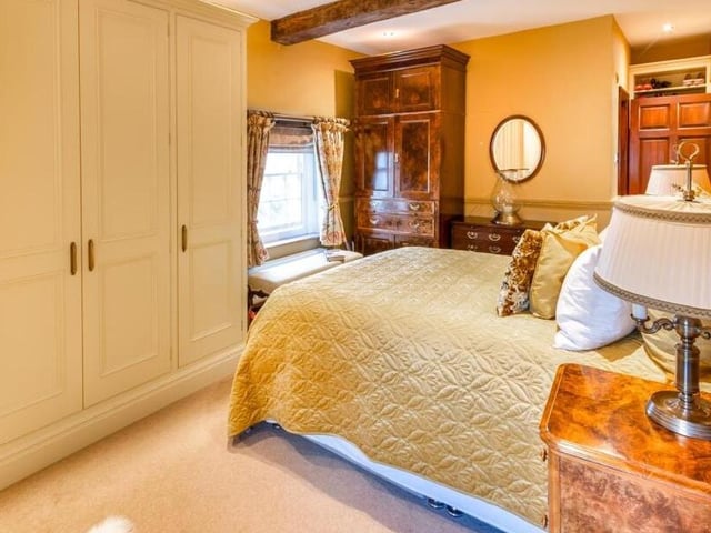 A beamed double bedroom in the property.