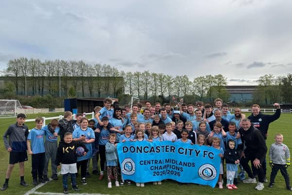 Doncaster City celebrate their promotion.