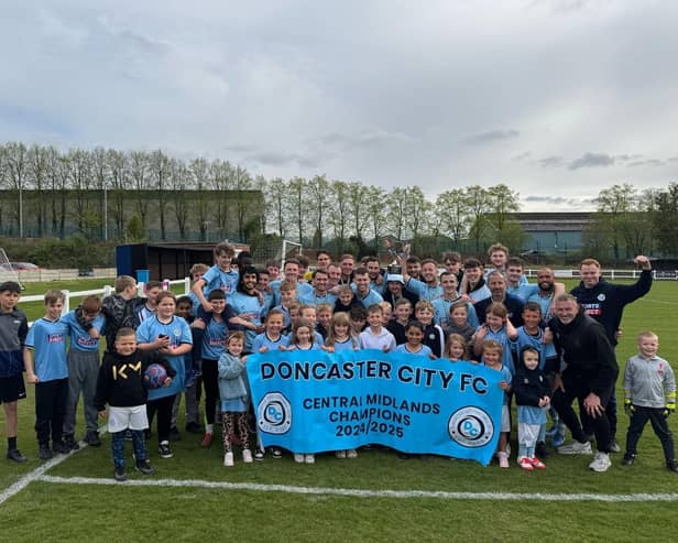 Doncaster City celebrate their promotion.
