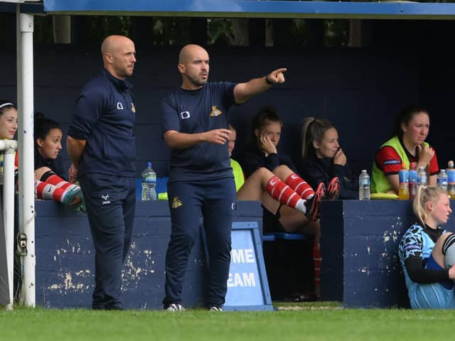 Former Belles manager Sam Winch (left) and his assistant Alexandre Brito Nogueira.