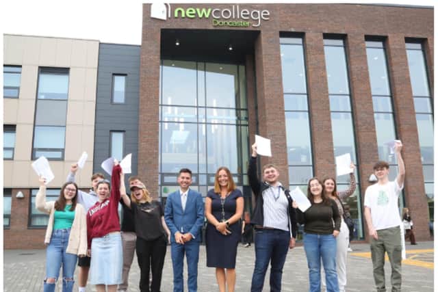 Students at New College celebrate their success.
