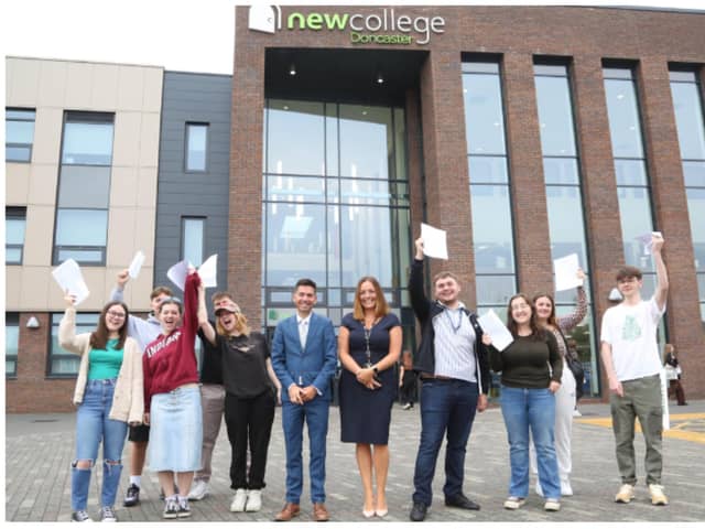 Students at New College celebrate their success.