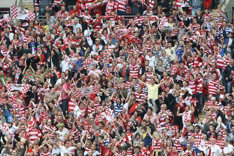 Doncaster Rovers fans celebrate victory over Leeds United in the League One play-off final at Wembley