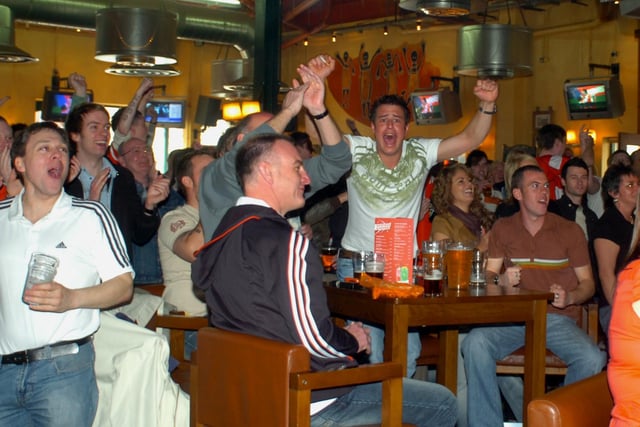 Fans celebrating Doncaster's second goal.