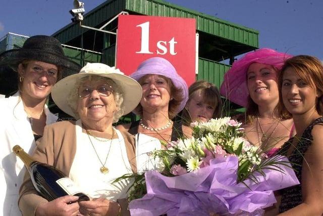 A group of racegoers enjoy a visit to Town Moor in 2002.