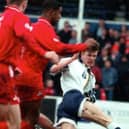 A young David Beckham in action against Doncaster Rovers in 1995.