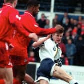 A young David Beckham in action against Doncaster Rovers in 1995.