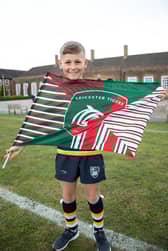 Hill House Pupil Celebrating with  Leicester Tigers Flag