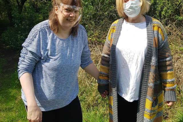 Resident Laura Turner from RMBI Home Harry Priestley House, in Thorne, enjoys a walk in the park with her mum Lesley Booth.