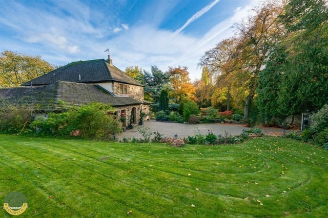 The property has extensive lawned grounds.