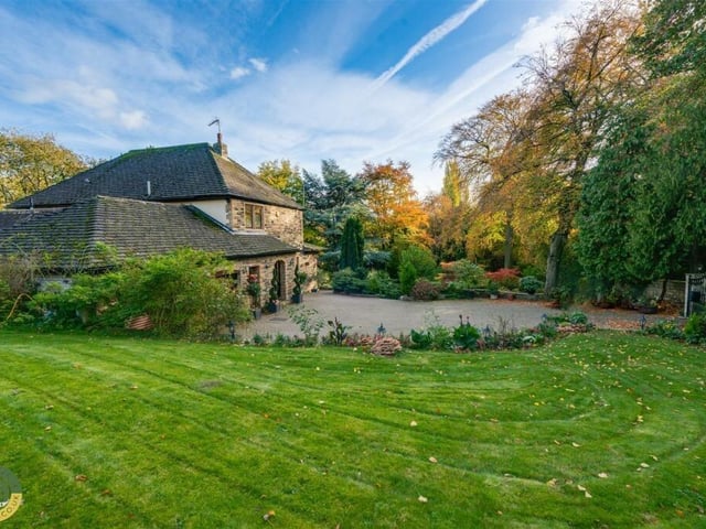The property has extensive lawned grounds.