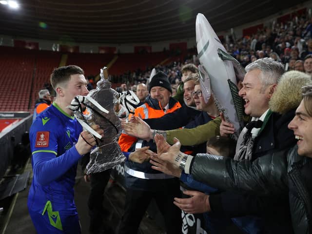 Harry Clifton celebrates with the Grimsby fans after their FA Cup scalp over Southampton back in 2023 (Photo by ADRIAN DENNIS/AFP via Getty Images)