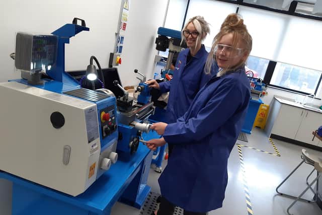 Natasha Naylor, curriculum director,  engineering, working with a pupil on the engineering equipment at Doncaster Univerity Technical College