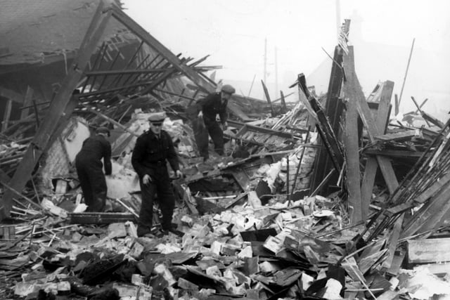 Workmen go about clearing up the debris from another raid. More than 270 people died in Sunderland during bombing from 1940 to 1941.