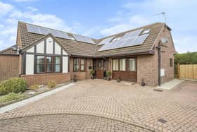 Harvester Close, Epworth. To the front of the property is a block paved driveway which provides ample off road parking to the side of which is a pebbled area with shrubs and trees.