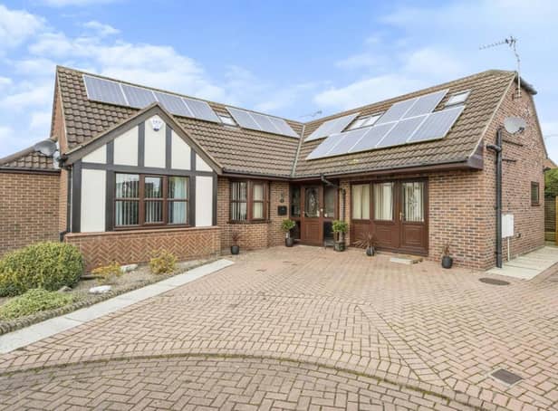 Harvester Close, Epworth. To the front of the property is a block paved driveway which provides ample off road parking to the side of which is a pebbled area with shrubs and trees.