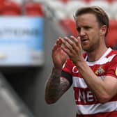 James Coppinger leaves the pitch for the final time as a professional footballer. Picture: Andrew Roe/AHPIX