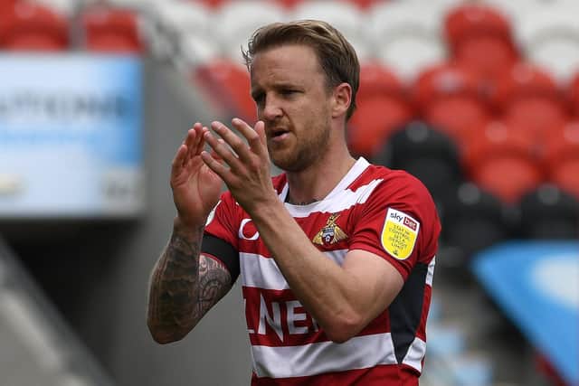 James Coppinger leaves the pitch for the final time as a professional footballer. Picture: Andrew Roe/AHPIX
