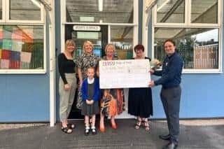 Tornedale Infant School receiving their cheque from Tesco