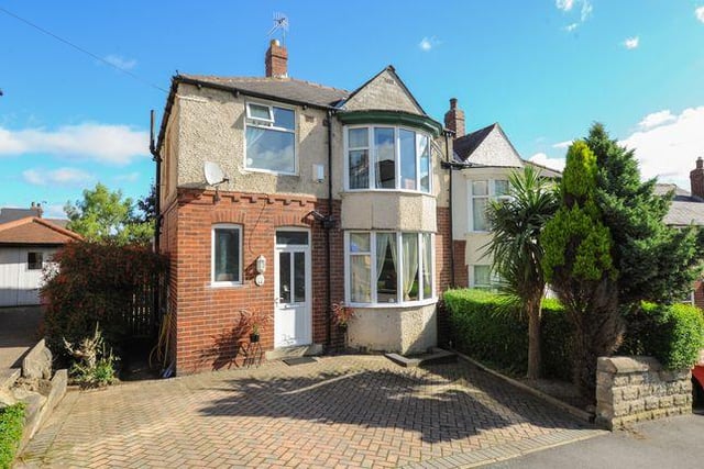 The three bedroom house has a raised conservatory with steps leading to the garden.