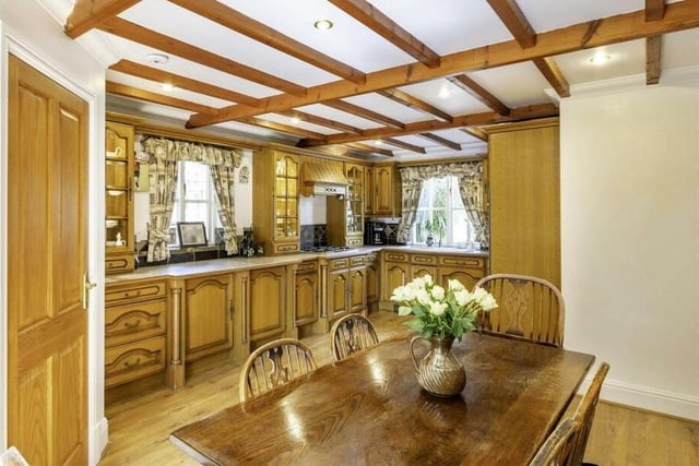 The country style kitchen with breakfast room has French doors out to the garden.