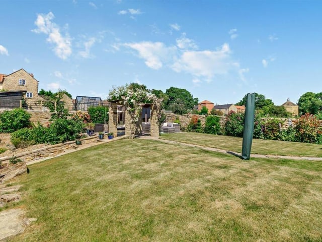 The lawned garden with established borders.