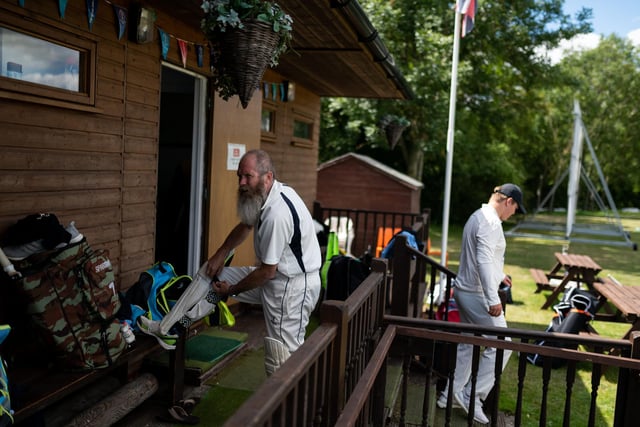 Players from Hambledon Cricket Club change outside the clubhouse to comply with social distancing measures as they return to action at Ridge Meadow at the weekend. Picture: Jordan Pettitt/Solent News & Photo Agency