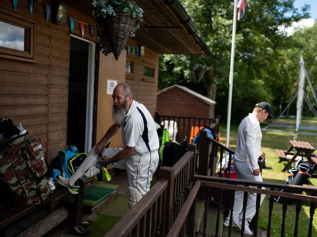 Players from Hambledon Cricket Club change outside the clubhouse to comply with social distancing measures as they return to action at Ridge Meadow at the weekend. Picture: Jordan Pettitt/Solent News & Photo Agency