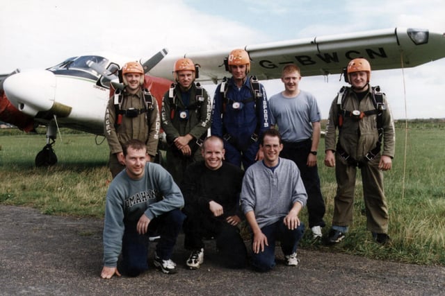 Employees from the Doncaster based Miller Brothers electrical store are pictured just before their charity parachute jump on Sunday, September 18, 1997