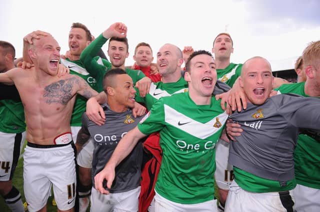 Doncaster Rovers celebrate winning the League One title in April 2013